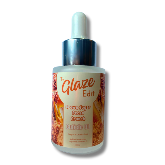 Bottle of 'The Glaze Edit' brown sugar pecan crunch cuticle oil on a white background